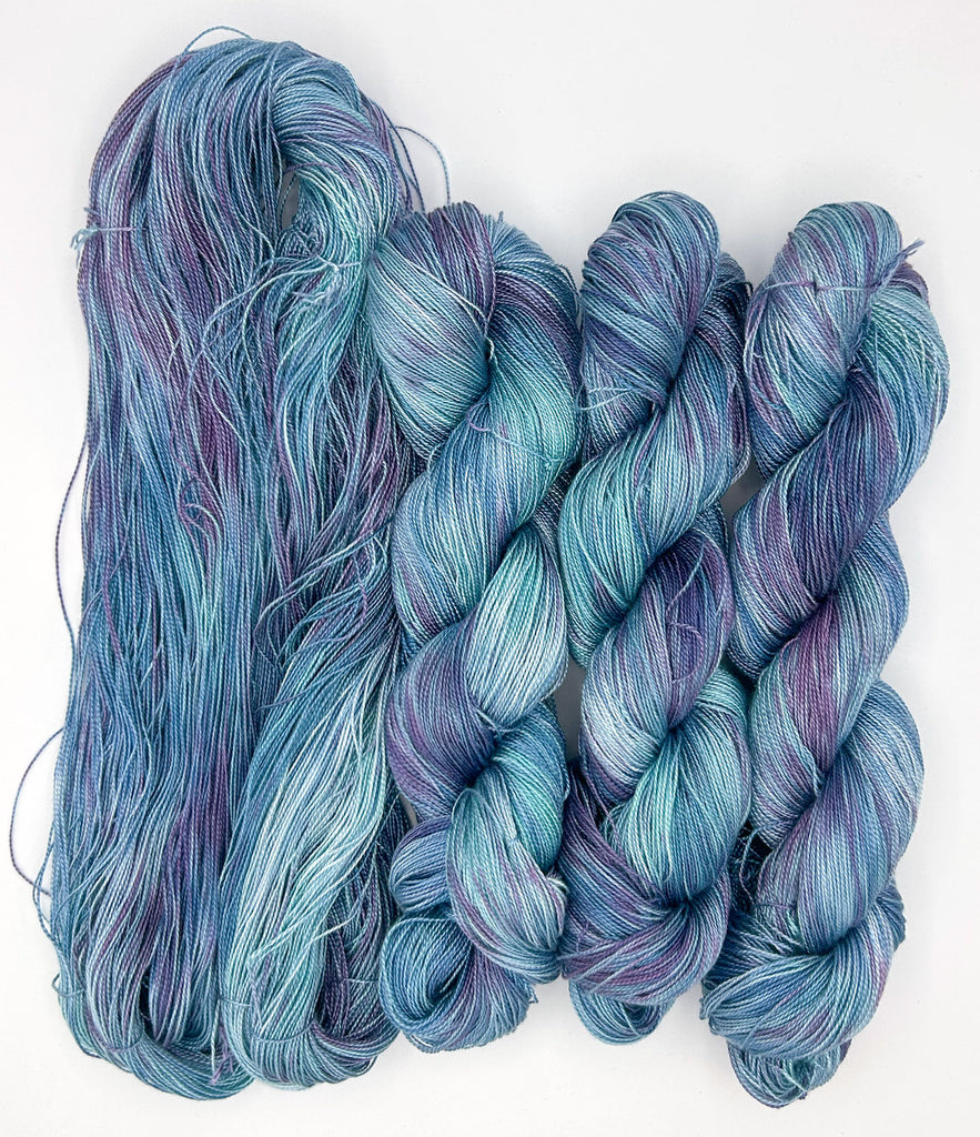 Midnight Lagoon Speckled Blue and Purple Hand-Painted Tencel™ 4 oz. yarn skeins