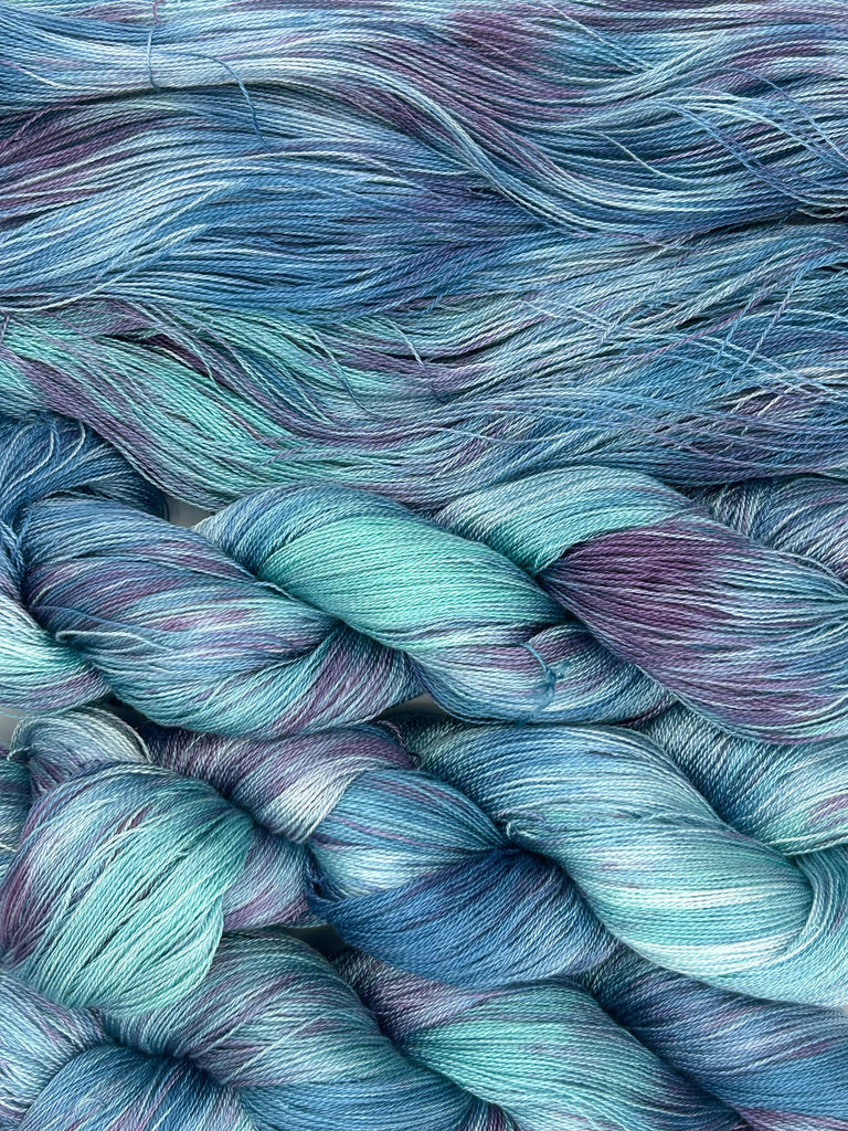 Midnight Lagoon Speckled Blue and Purple Hand-Painted Tencel™ 4 oz. yarn skeins
