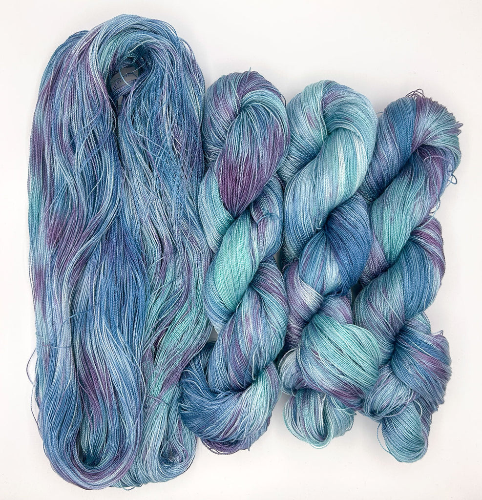 Midnight Lagoon Speckled Blue and Purple Hand-Painted Tencel™ 4 oz. yarn skeins