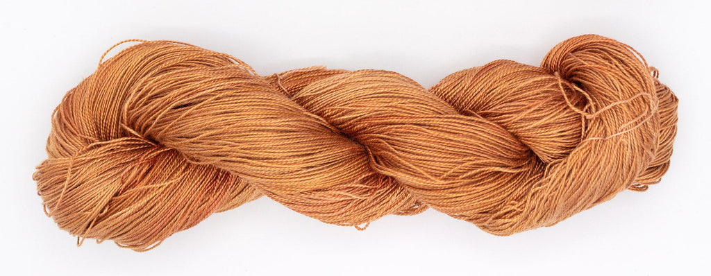 Hand-Dyed 5/2 Tencel™ 4 oz yarn skein - Naturally dyed by Jean Haley Dye + Design. Color 1 - light orange
